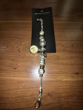 New York & Company Gold and Clear Beaded Bracelet Watch with Charm